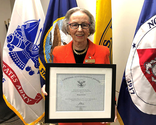 Dr. Inge Guen with award